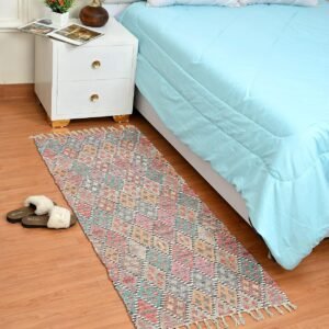 Handmade upcycled sustainable dhurrie rug with modern floral print for living room decor.