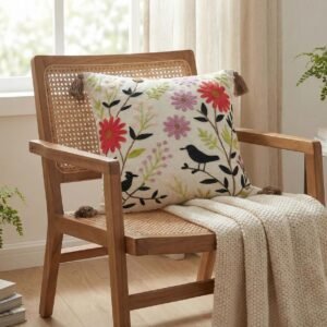 Hand-embroidered floral cushion cover by TheLitLoom featuring blue and earthy toned flowers on premium white cotton fabric with corner tassels.
